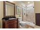 Bathroom featuring a glass shower, patterned tile and dark granite sink at 2120 Blackheath Trce, Alpharetta, GA 30005
