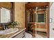 Bathroom featuring vanity and a luxurious sauna with wooden benches and ambient lighting at 2120 Blackheath Trce, Alpharetta, GA 30005