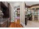 Hallway entrance featuring a view into a luxurious bathroom with marble countertops and a glass shower at 2120 Blackheath Trce, Alpharetta, GA 30005