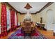 Formal dining room featuring hardwood floors and chandelier at 2120 Blackheath Trce, Alpharetta, GA 30005