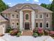 Elegant brick home with beautiful landscaping and a grand entrance at 2120 Blackheath Trce, Alpharetta, GA 30005
