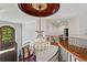 Grand two-story foyer featuring a curved staircase, hardwood floors, and a stunning chandelier at 2120 Blackheath Trce, Alpharetta, GA 30005