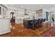 Open-concept kitchen with stainless steel appliances, island with seating, and hardwood floors at 2120 Blackheath Trce, Alpharetta, GA 30005