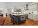 Open kitchen with granite countertops, stainless appliances, hardwood floors, and a large island with bar seating at 2120 Blackheath Trce, Alpharetta, GA 30005