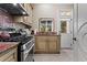 Well-equipped kitchen features stainless steel appliances, granite countertops, and ample storage at 2120 Blackheath Trce, Alpharetta, GA 30005