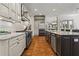 Spacious kitchen featuring granite countertops, stainless steel appliances, and hardwood floors at 2120 Blackheath Trce, Alpharetta, GA 30005