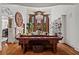 Elegant living room with a chandelier, hardwood floors, and custom shelving at 2120 Blackheath Trce, Alpharetta, GA 30005