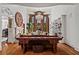 Bright living room with high ceilings, chandelier, hardwood floors and decorative fireplace mantel at 2120 Blackheath Trce, Alpharetta, GA 30005