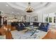 Open-concept living space with hardwood floors and a seamless flow into the kitchen area at 2120 Blackheath Trce, Alpharetta, GA 30005