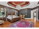 Large main bedroom with hardwood floors, a trey ceiling, chandelier, and stylish decor at 2120 Blackheath Trce, Alpharetta, GA 30005