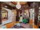 Elegant office boasting dark wood paneling and custom built-ins at 2120 Blackheath Trce, Alpharetta, GA 30005