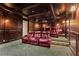 In-home movie theater with tiered seating featuring leather reclining chairs at 2120 Blackheath Trce, Alpharetta, GA 30005