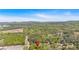 An aerial view shows the neighborhood with lush greenery, showcasing the property's location at 63 Seminole Ne Rd, Cartersville, GA 30121