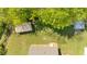 Aerial view of a backyard featuring a shed and a house with a light colored exterior at 63 Seminole Ne Rd, Cartersville, GA 30121