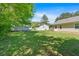 Green backyard with shed and the exterior of a light-colored home at 63 Seminole Ne Rd, Cartersville, GA 30121