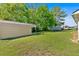 Backyard with a detached garage, lots of green grass, and an RV at 63 Seminole Ne Rd, Cartersville, GA 30121