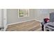 Bedroom area featuring hard surface floors, a desk, and a window at 63 Seminole Ne Rd, Cartersville, GA 30121