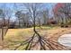 Beautiful backyard with mature trees, providing shade and a sense of privacy for outdoor enjoyment at 720 Lakeglen Dr, Suwanee, GA 30024