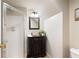 Charming bathroom with vanity, mirror, and shower; an elegant touch in a well-appointed space at 720 Lakeglen Dr, Suwanee, GA 30024