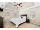 Bright bedroom with tray ceilings, large windows, ceiling fan, and neutral decor at 720 Lakeglen Dr, Suwanee, GA 30024