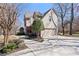 Traditional home with two-car garage, brick and vinyl siding, professional landscaping, and concrete driveway at 720 Lakeglen Dr, Suwanee, GA 30024