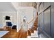 Inviting foyer with hardwood floors, staircase, and views into living spaces at 720 Lakeglen Dr, Suwanee, GA 30024