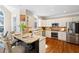 Beautiful kitchen featuring granite countertops, stainless steel appliances, and a breakfast bar at 720 Lakeglen Dr, Suwanee, GA 30024