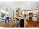 Bright eat-in kitchen with stainless steel appliances and granite countertops at 720 Lakeglen Dr, Suwanee, GA 30024