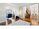 Open-concept living room showcasing hardwood floors and views to other living spaces at 720 Lakeglen Dr, Suwanee, GA 30024