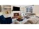 Cozy living room with fireplace, built-in shelves, and comfortable seating at 720 Lakeglen Dr, Suwanee, GA 30024