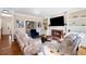Comfortable living room with a brick fireplace and built-in shelving at 720 Lakeglen Dr, Suwanee, GA 30024