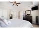 Spacious main bedroom with neutral colors and an open entrance to the ensuite at 720 Lakeglen Dr, Suwanee, GA 30024