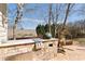 Covered outdoor kitchen and patio area is perfect for barbecues and entertaining at 720 Lakeglen Dr, Suwanee, GA 30024