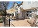 Outdoor patio with ample seating including a swing and an umbrella for shade at 720 Lakeglen Dr, Suwanee, GA 30024