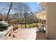 Spacious patio includes seating, a grassy backyard, and a porch swing perfect for relaxation at 720 Lakeglen Dr, Suwanee, GA 30024