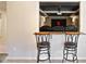 Home theater with bar looking into seating with projector at 720 Lakeglen Dr, Suwanee, GA 30024