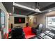 Home theater room with cozy seating, projector and dark, tiered ceilings at 720 Lakeglen Dr, Suwanee, GA 30024