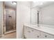 Bright bathroom featuring a glass enclosed shower and vanity with white cabinets and sink at 8215 Majors Mill Dr, Cumming, GA 30041