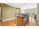 Stylish kitchen with a granite countertop, stainless steel appliances and view to Gathering room at 8215 Majors Mill Dr, Cumming, GA 30041