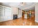 Cozy living room with built-in bookshelves, a fireplace, and an open view to the kitchen at 8215 Majors Mill Dr, Cumming, GA 30041