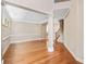Inviting living room with hardwood floors, a staircase, and neutral paint colors at 8215 Majors Mill Dr, Cumming, GA 30041