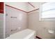 Bathroom with tiled walls, and vintage fixtures at 1715 E Clifton Ne Rd, Atlanta, GA 30307