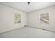 Bright bedroom features neutral carpet, and two large windows at 1715 E Clifton Ne Rd, Atlanta, GA 30307