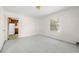 Bright room with neutral carpet, a window, and an open doorway to the kitchen at 1715 E Clifton Ne Rd, Atlanta, GA 30307