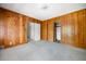 Bedroom with wood paneled walls and neutral carpet at 1715 E Clifton Ne Rd, Atlanta, GA 30307