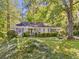 Charming single-story home with a lush front yard, mature trees, and neutral siding at 1715 E Clifton Ne Rd, Atlanta, GA 30307
