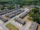 An expansive aerial view of a well-planned community showcasing orderly rows of homes and lush green spaces at 262 Quay Dr, Lawrenceville, GA 30044