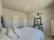 Cozy bedroom with soft lighting, plush bedding, and stylish decor, offering a relaxing space at 262 Quay Dr, Lawrenceville, GA 30044