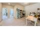 Versatile bonus room with neutral carpet, ample storage, and natural light, perfect for a home office or playroom at 262 Quay Dr, Lawrenceville, GA 30044