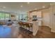 Open-concept kitchen with granite countertops, stainless steel appliances, and island seating at 262 Quay Dr, Lawrenceville, GA 30044